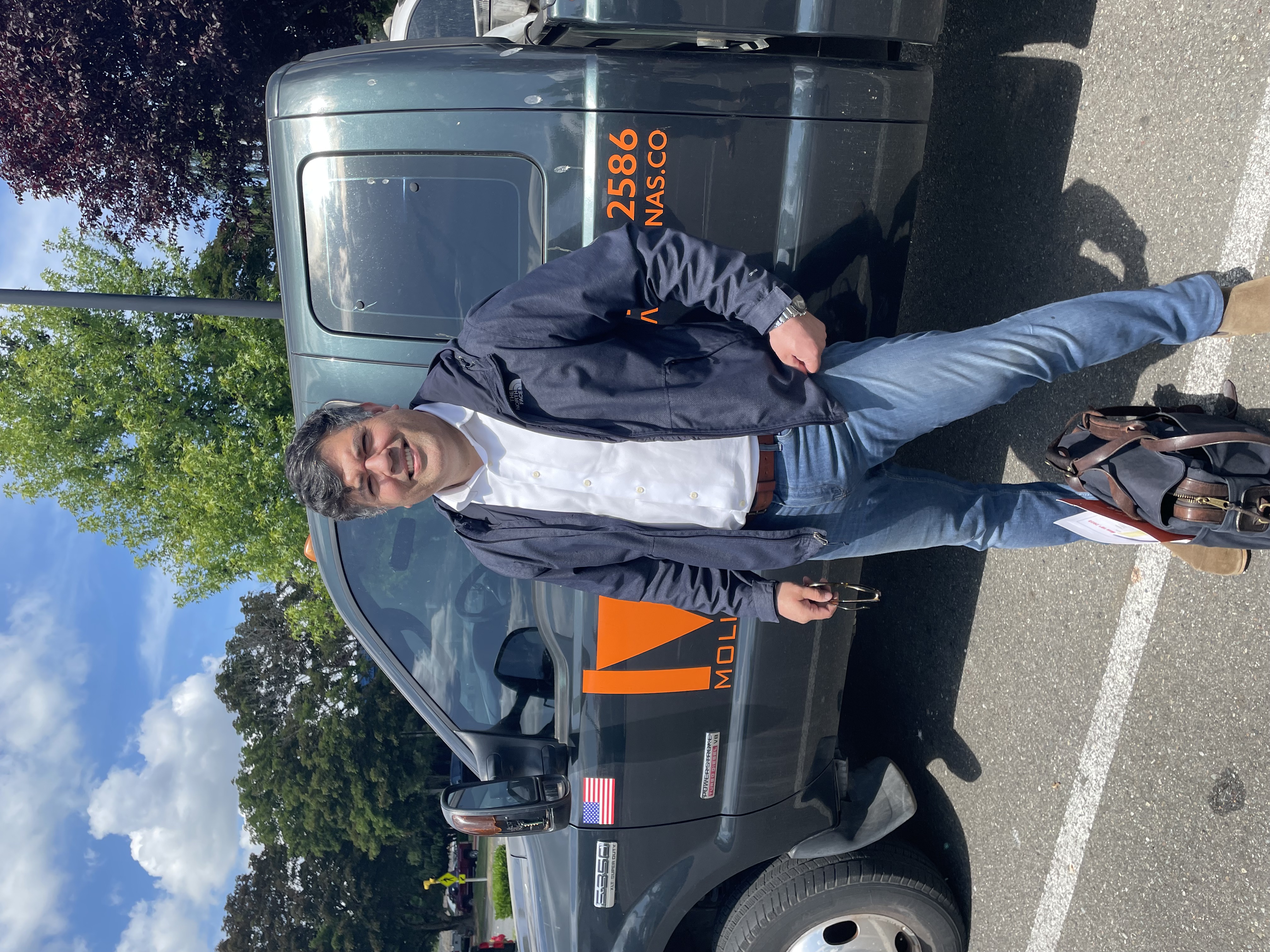 David Molina in the field with contractor team vehicle